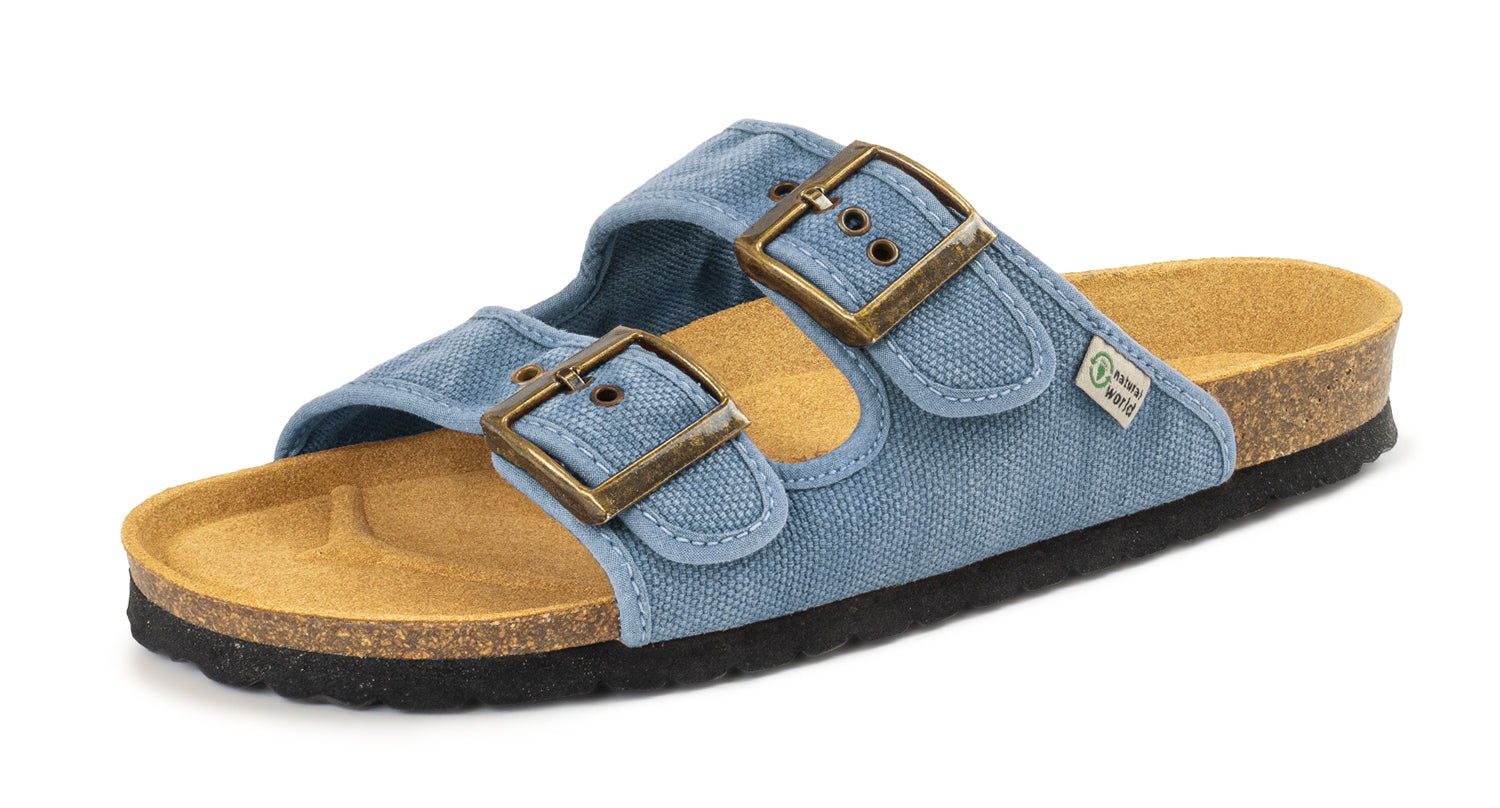 Blue sandal with brown buckle and sole on a white background