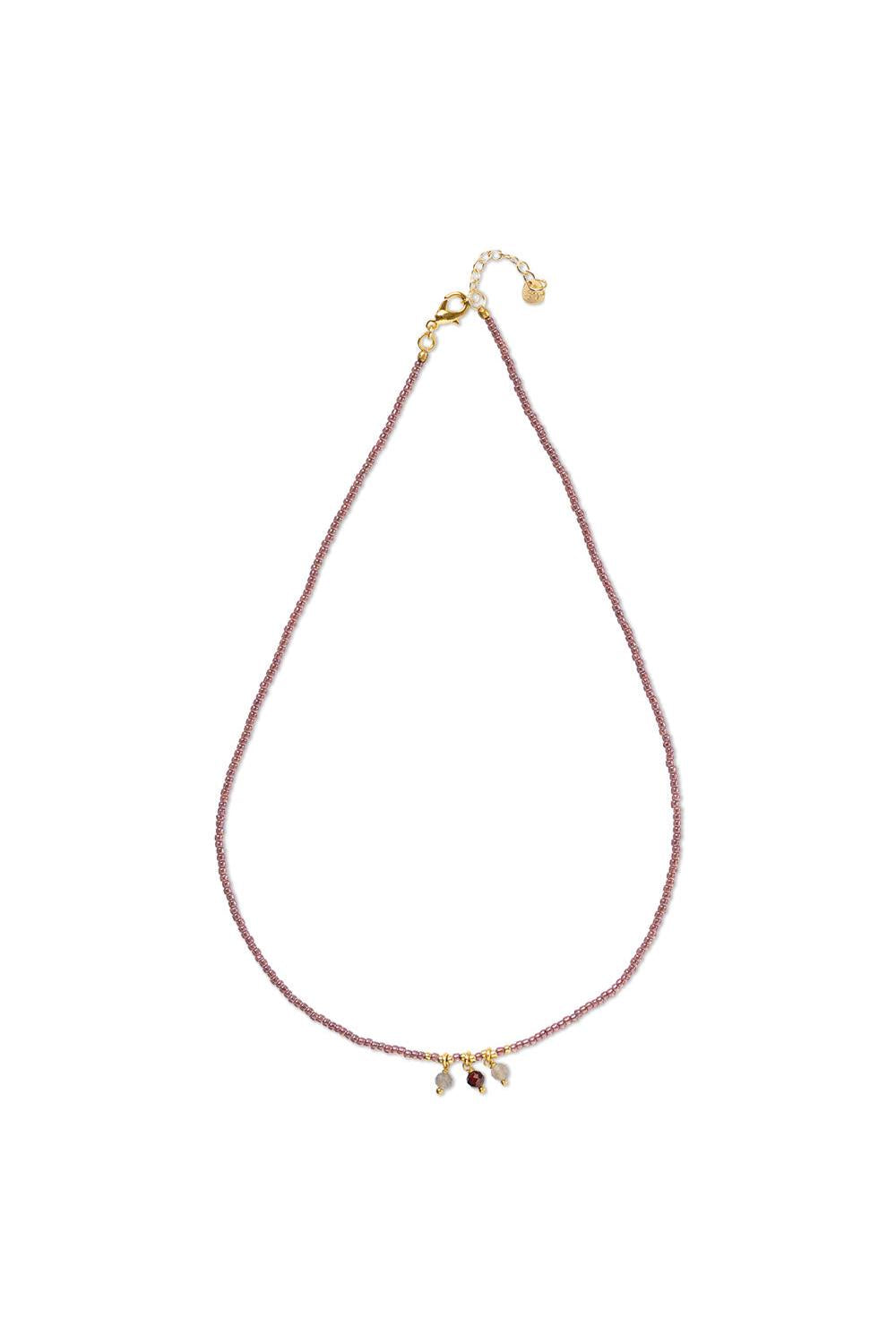Necklace with small gemstones on a white background