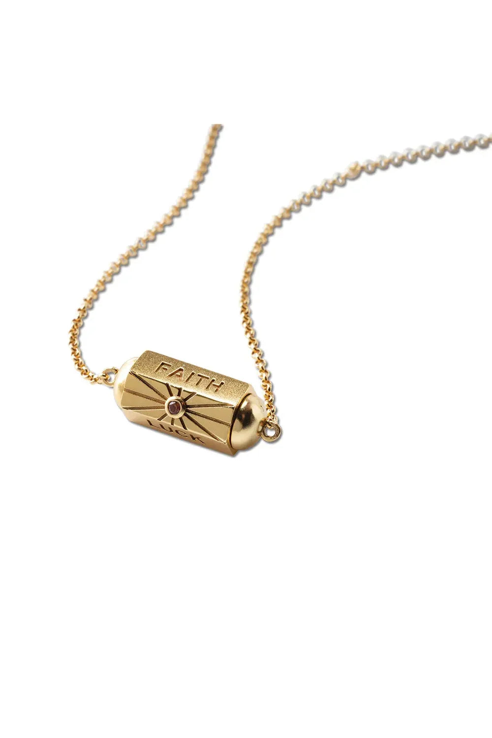 Gold necklace with a cylindrical pendant on a white background