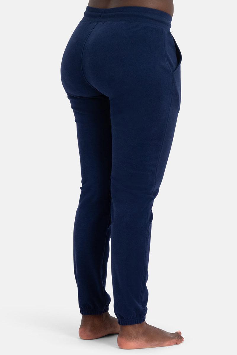 Navy blue bamboo sweatpants worn by a person on a white background