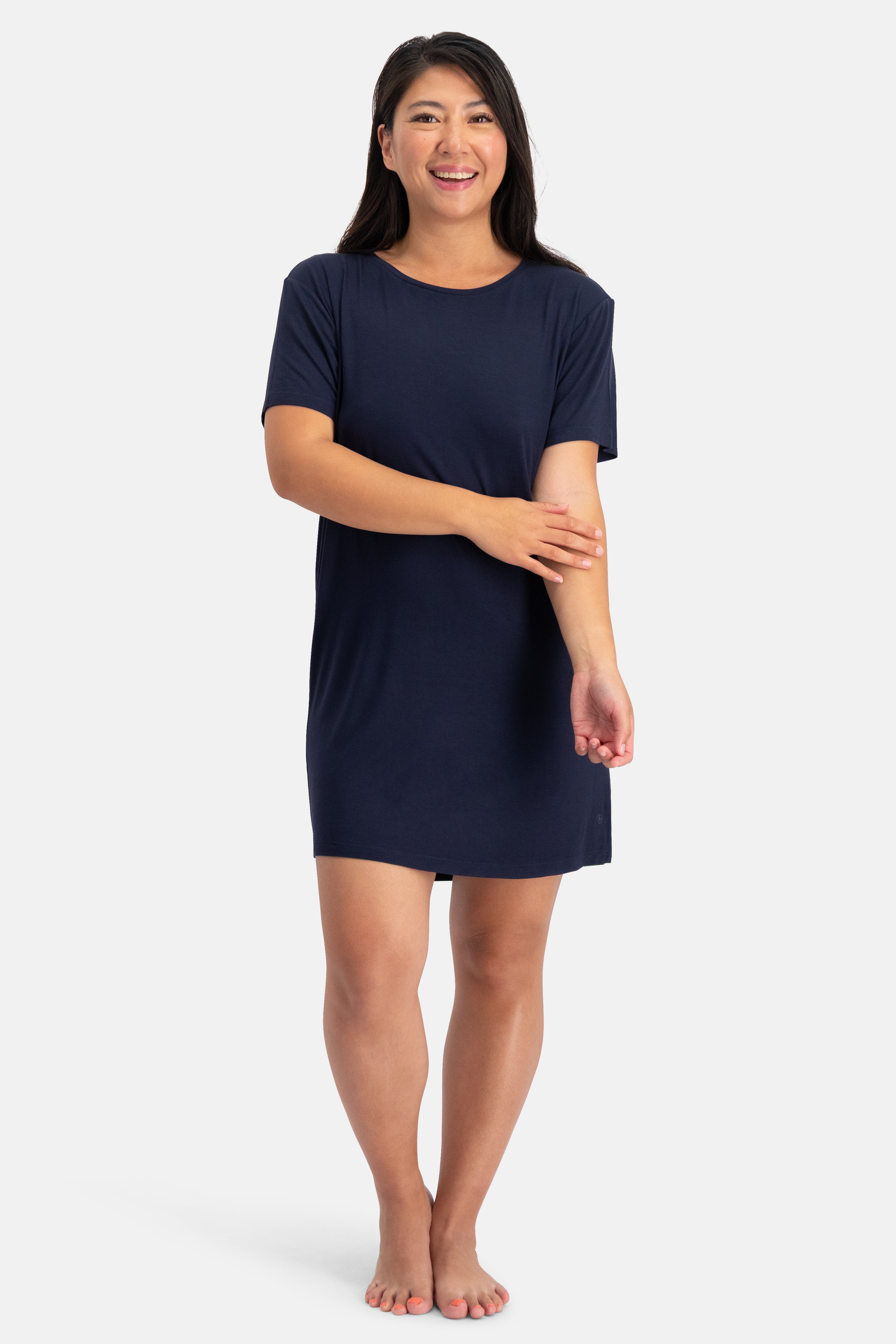 Woman wearing a navy blue bamboo nightshirt on a white background