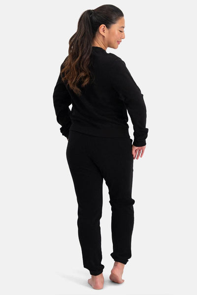 Woman wearing a black bamboo outfit on a white background