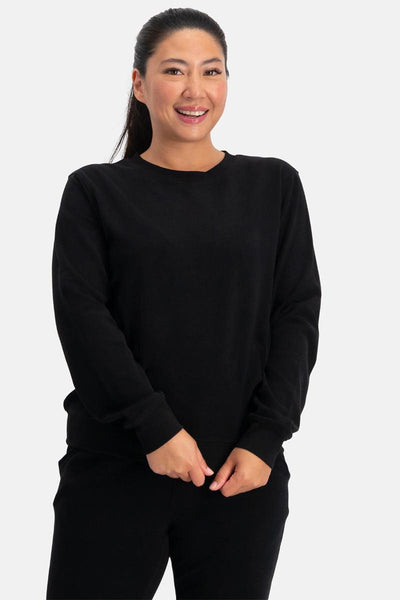 Woman wearing a black bamboo sweater on a white background