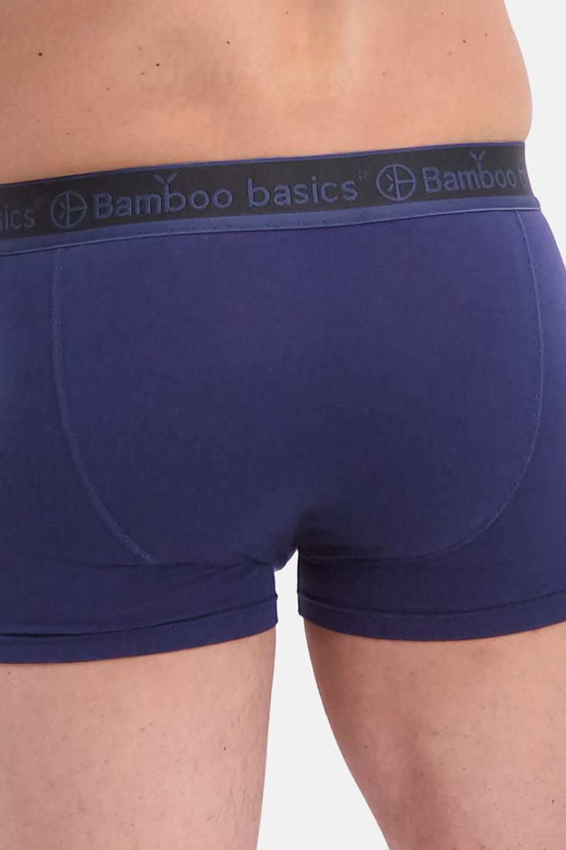 Navy blue boxer briefs with a visible brand logo on the waistband against a neutral background