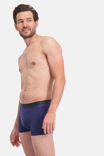 Man wearing a blue underwear on a white background