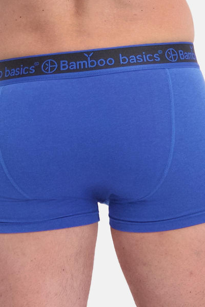 Blue boxer briefs with Bamboo Basics waistband on a plain background
