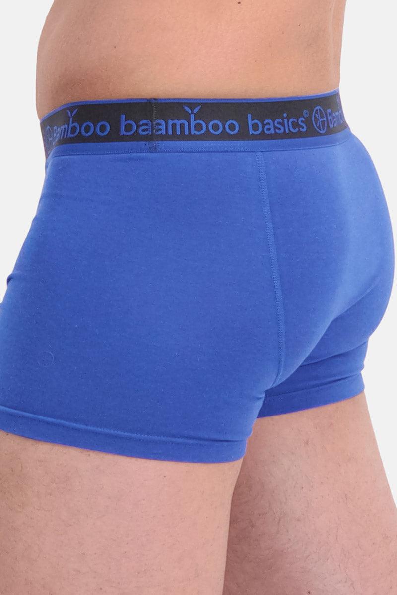 Blue boxer briefs with a black waistband featuring 'bamboo basics' branding on a white background.