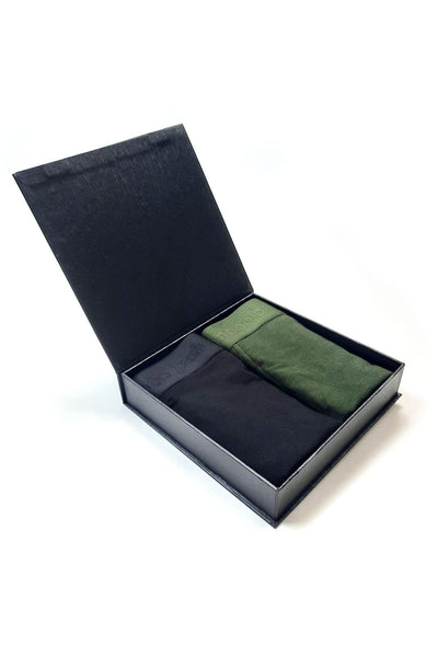 Black box with black and green bamboo boxers inside on a white background