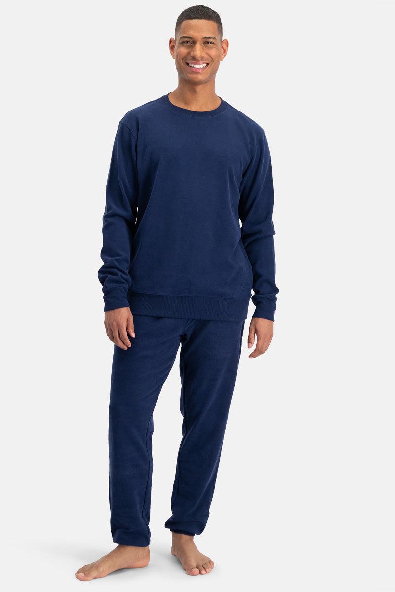 Man wearing navy blue bamboo co ord on a white background