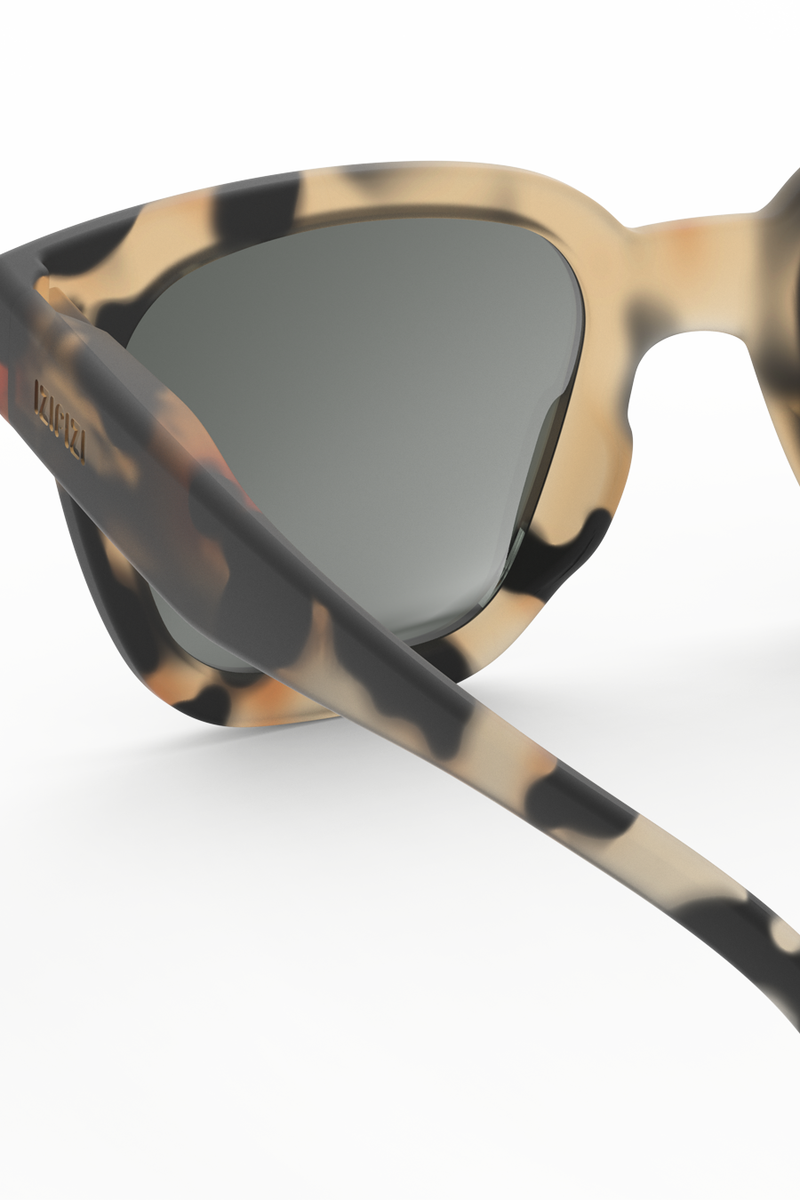 Kids sunglasses with tortoiseshell frame and dark lenses on a white background