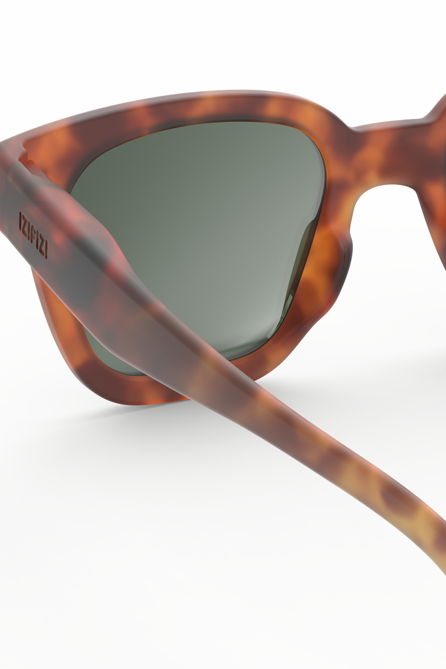 Close-up of tortoise pattern and matte soft-touch finish on rectangular frame.
