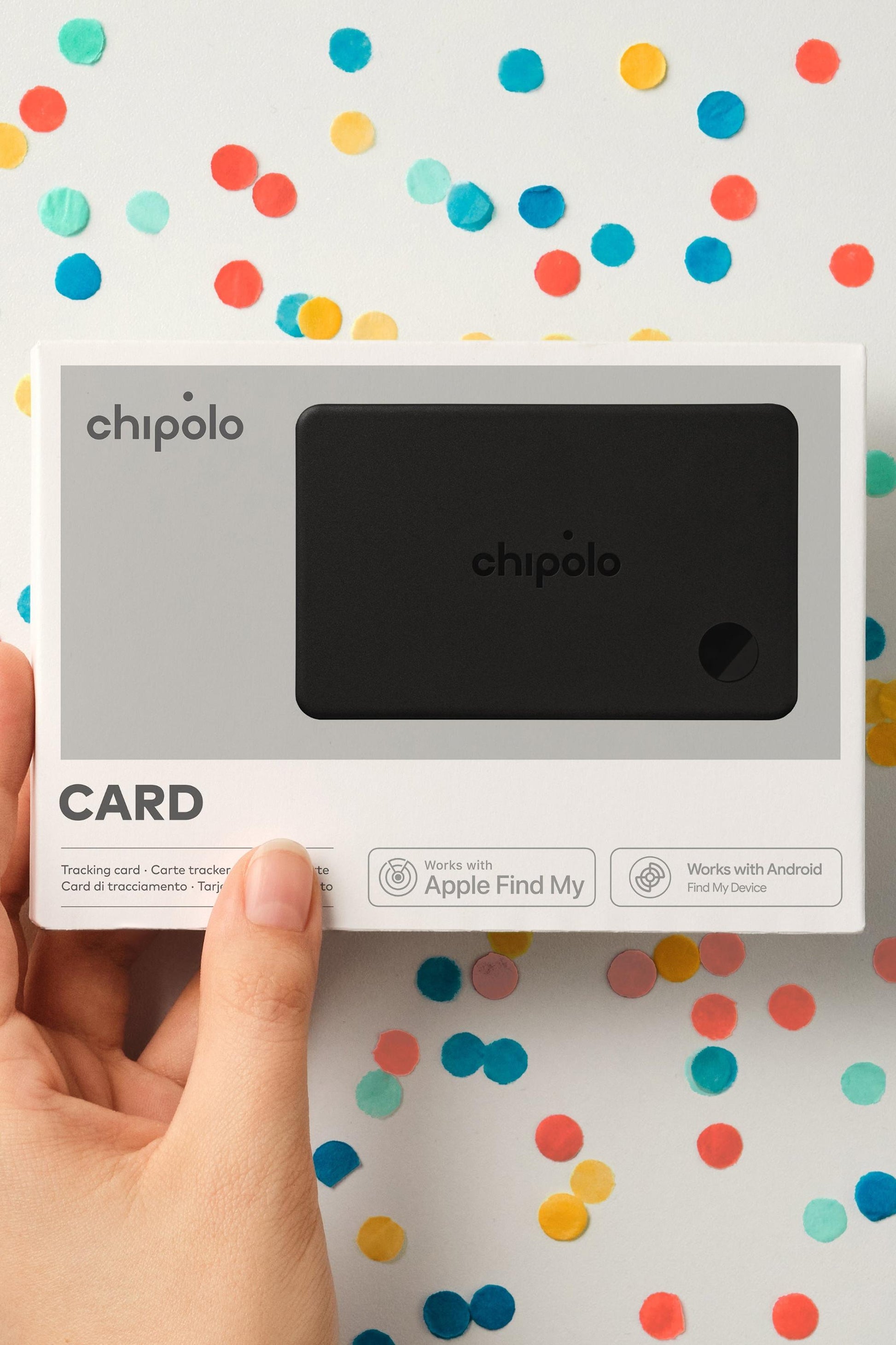 Chipolo card packaging held by a hand with a colorful polka dot background