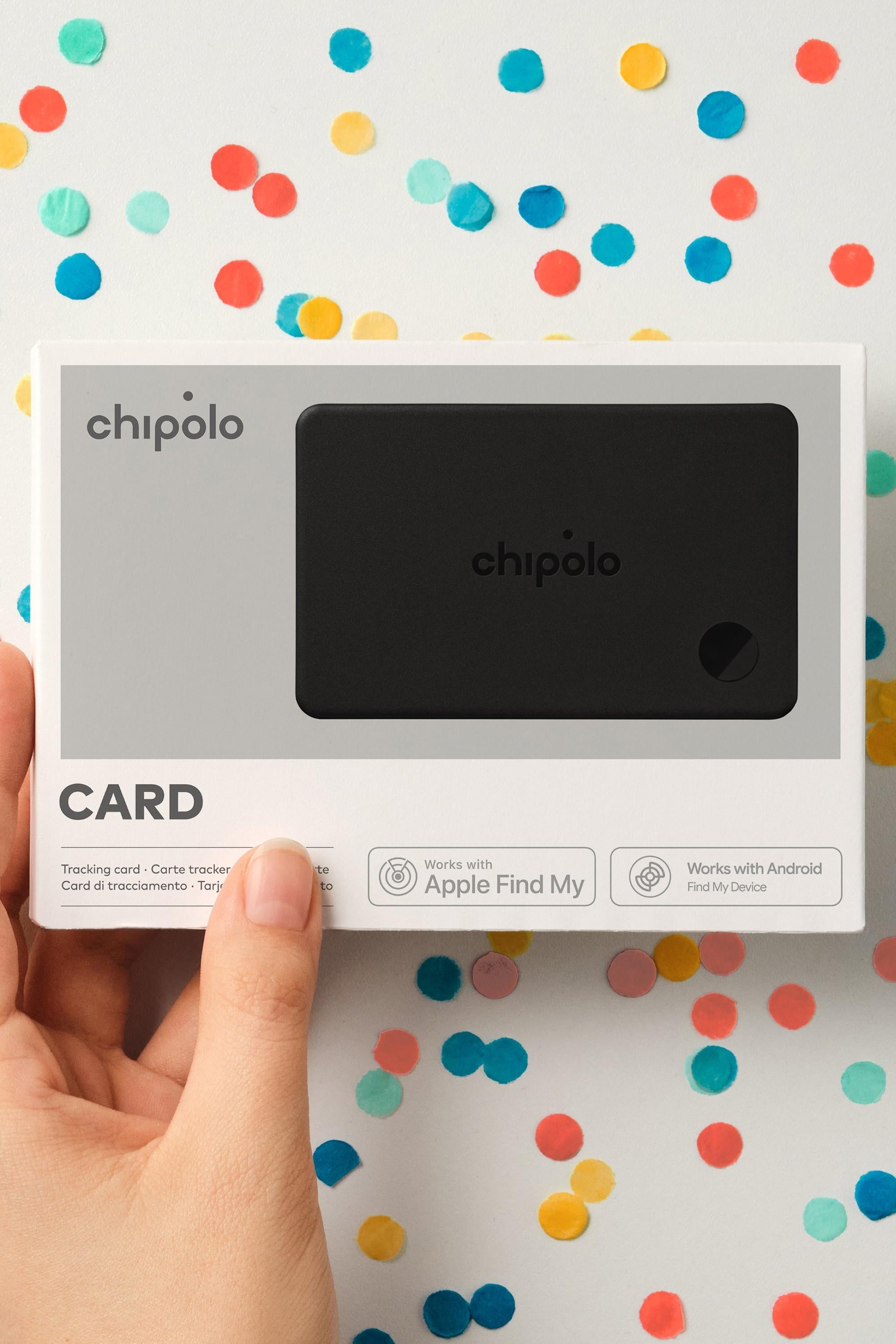 Chipolo card packaging held by a hand with a colorful polka dot background