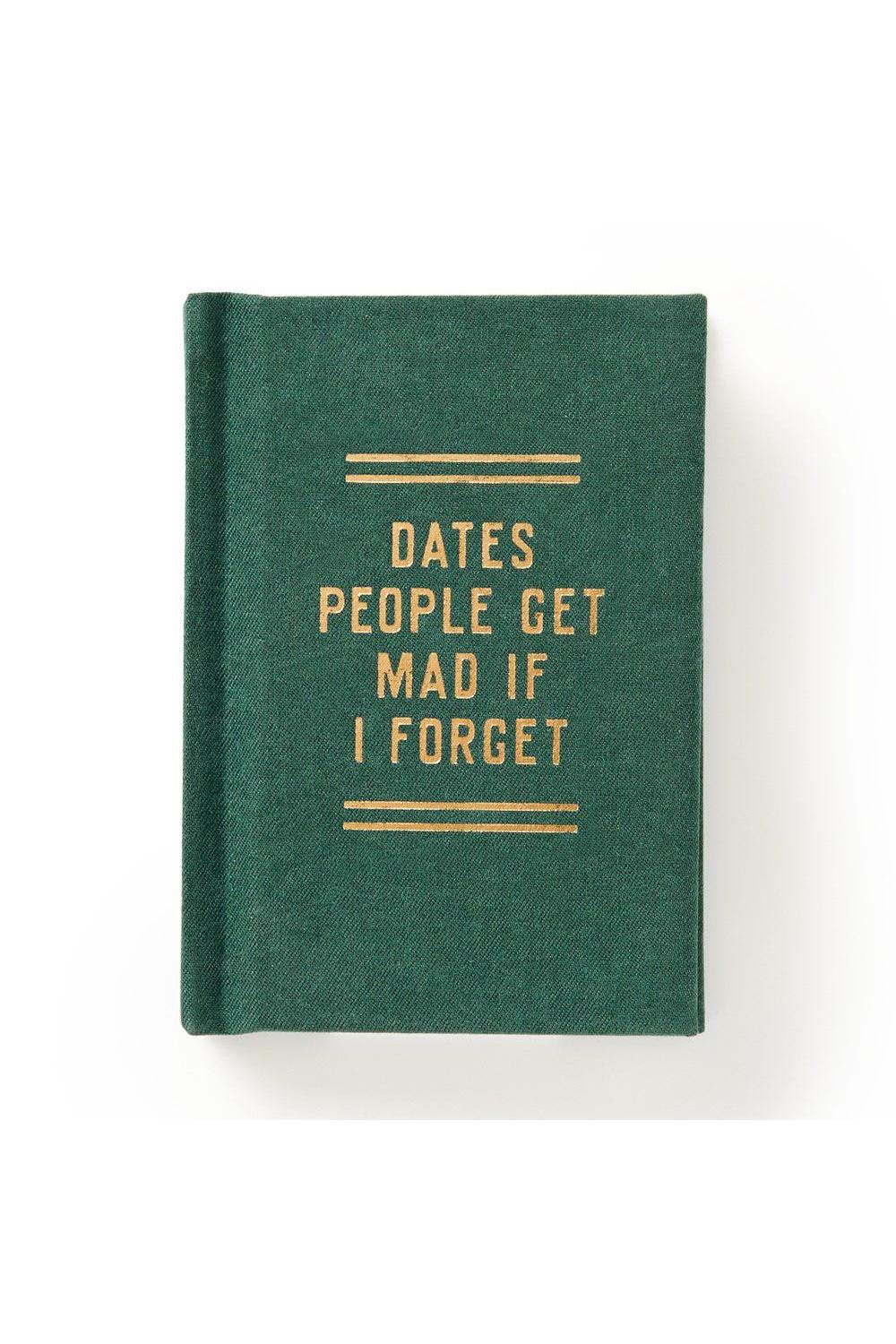 Green notebook with gold text on a white background