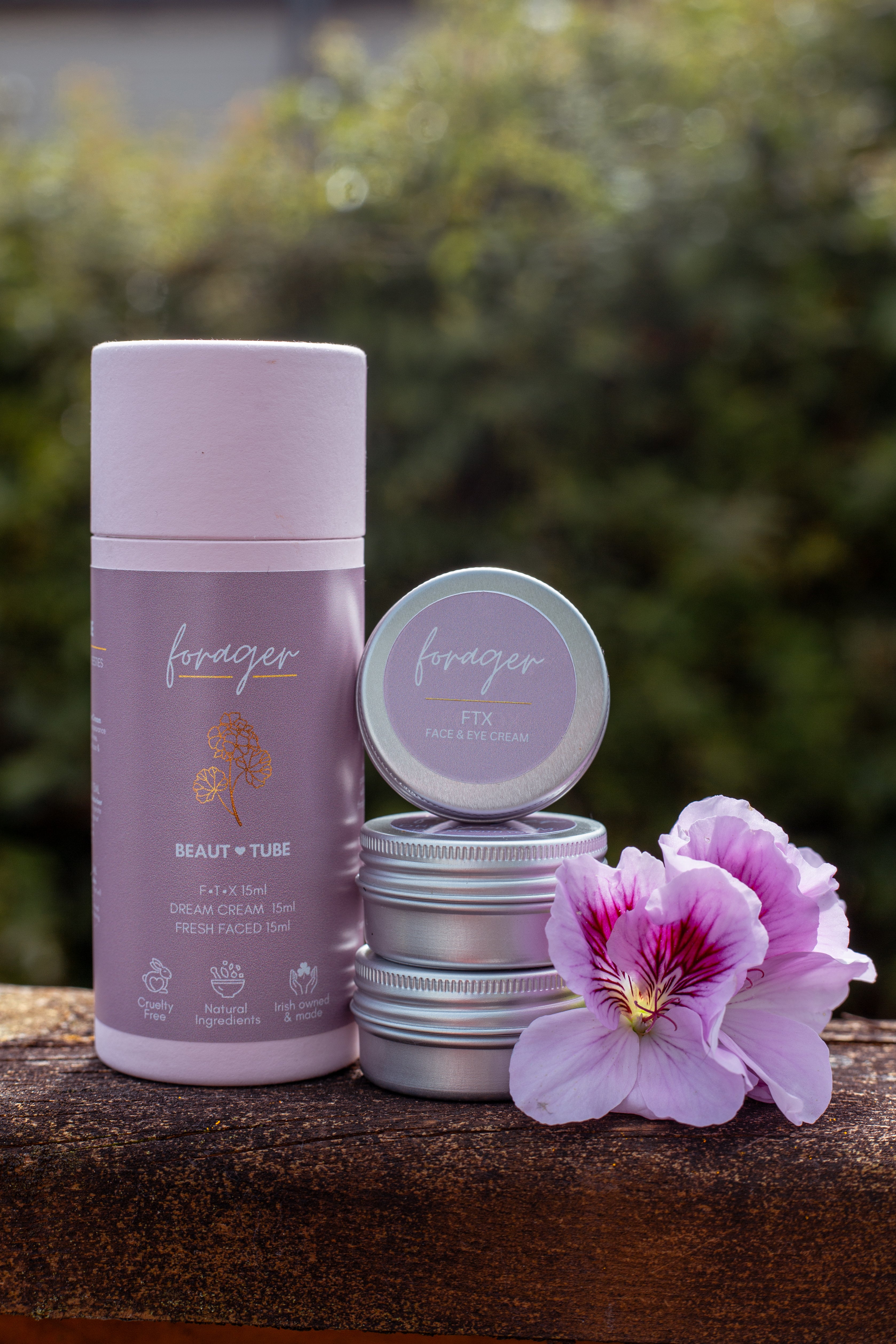 Forager beauty products on a wooden surface with a blurred natural background