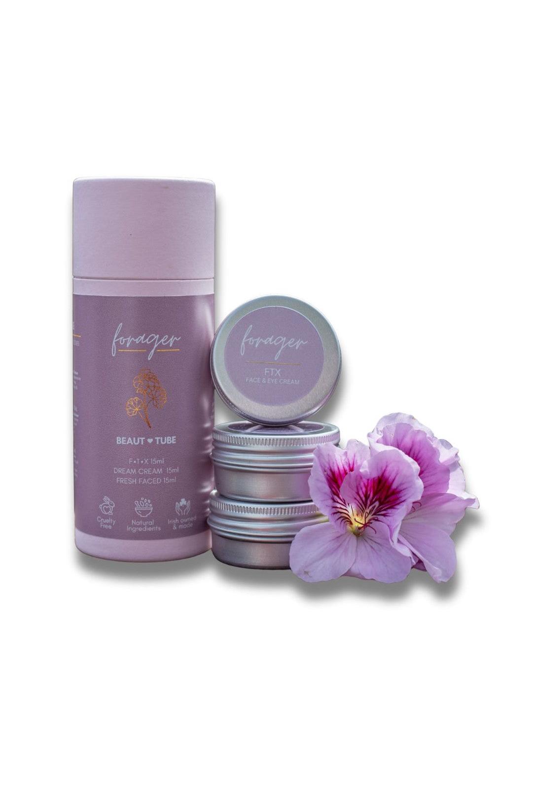 Lavender-colored skincare product set with a purple flower on a white background