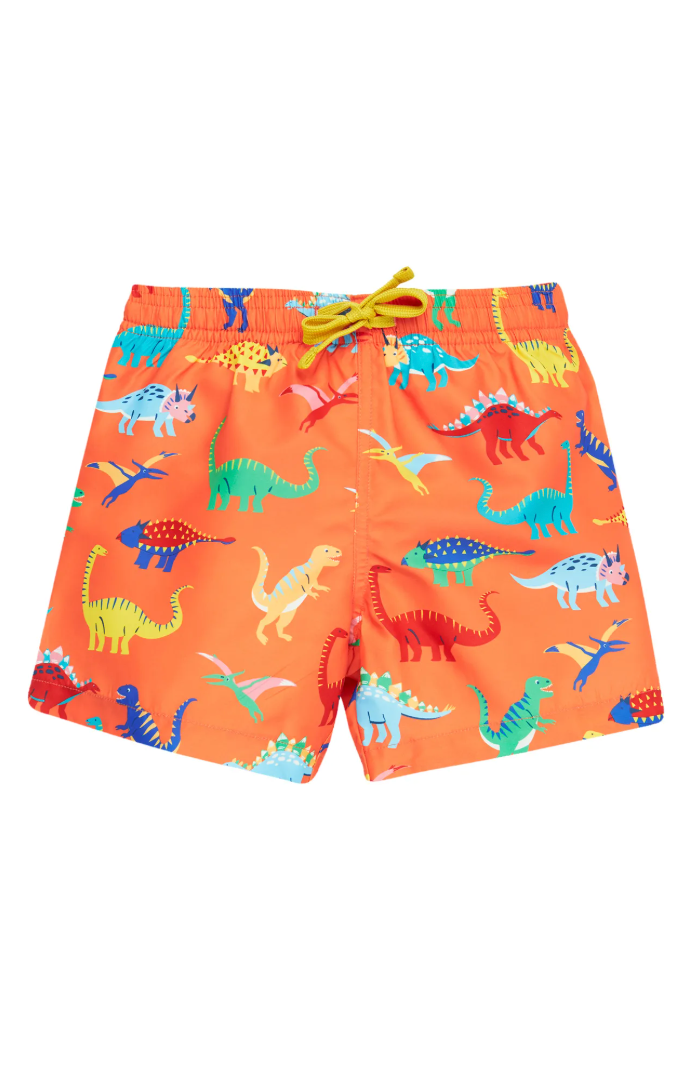 Bright orange swim shorts featuring a playful all-over print of multicoloured dinosaurs and salamanders, with a yellow drawcord at the waistband.