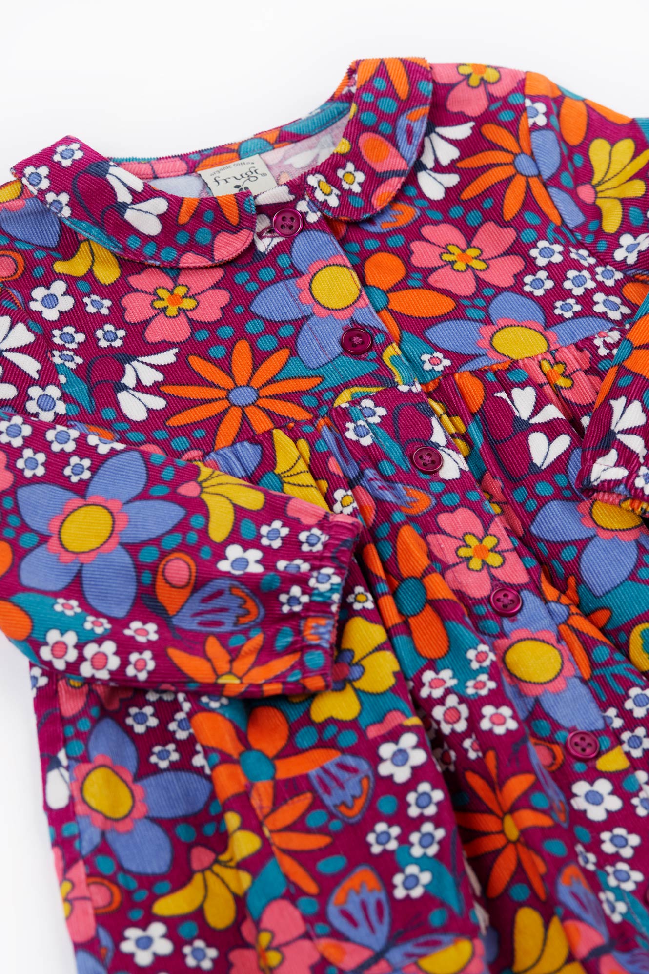 Colorful Frugi floral-patterned dress with a collar on a white background