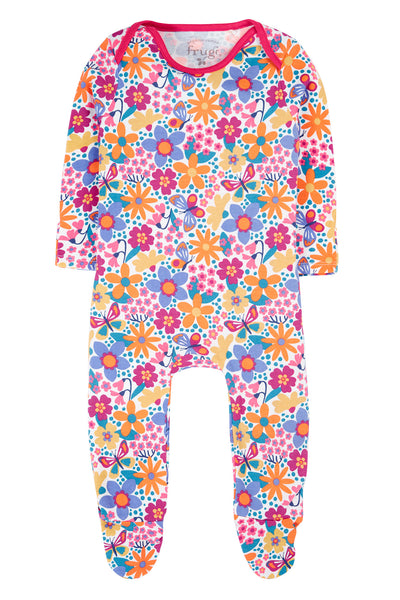 Colourful floral-patterned baby onesie on a white background