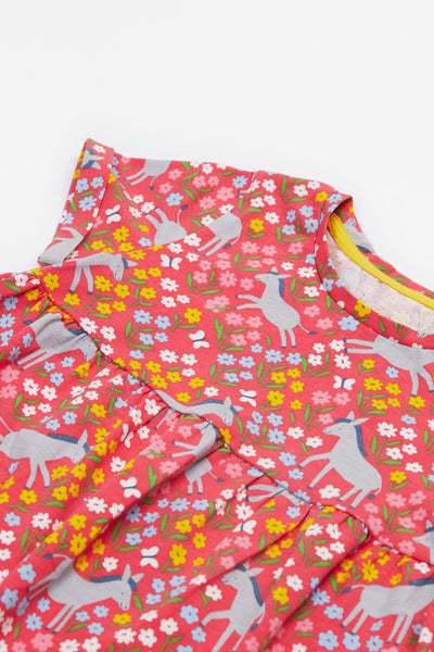 Close-up of the organic cotton fabric featuring cheerful donkey themed print.