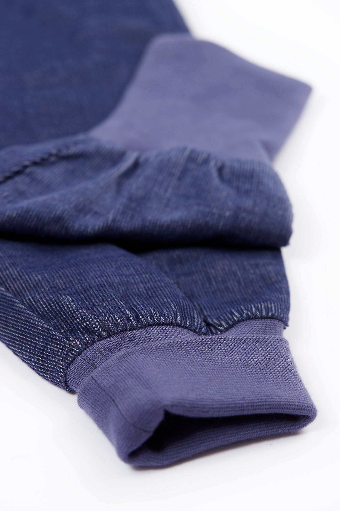 Folded blue fabric on a white background