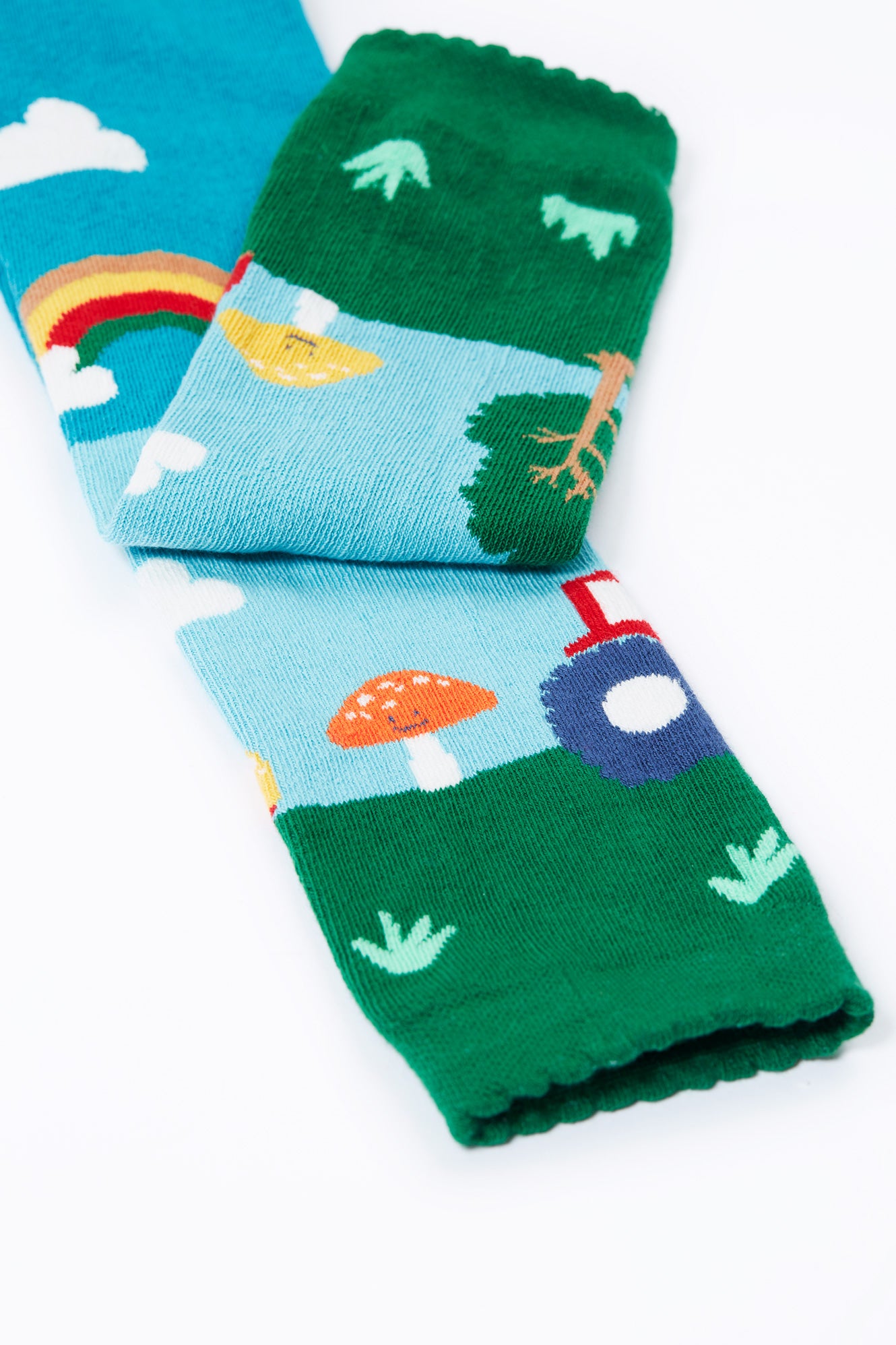 Kids organic cotton tights with nature-themed designs on a white background
