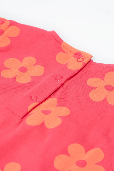 Back of the Frugi Little Lola Dress, highlighting the popper fastenings for easy dressing.