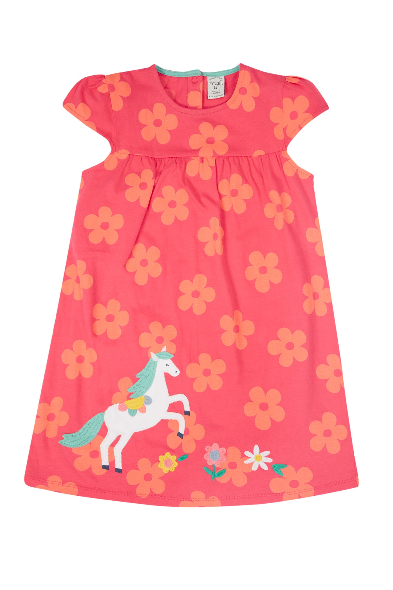 Bright pink organic cotton dress featuring a playful white horse applique with multicoloured mane and tail, set against a backdrop of bold orange flowers.