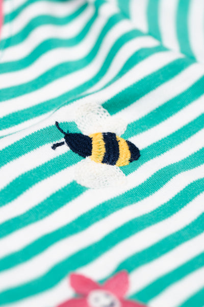 Detailed bee appliqué on Frugi Orion striped organic cotton top, made with GOTS certified cotton