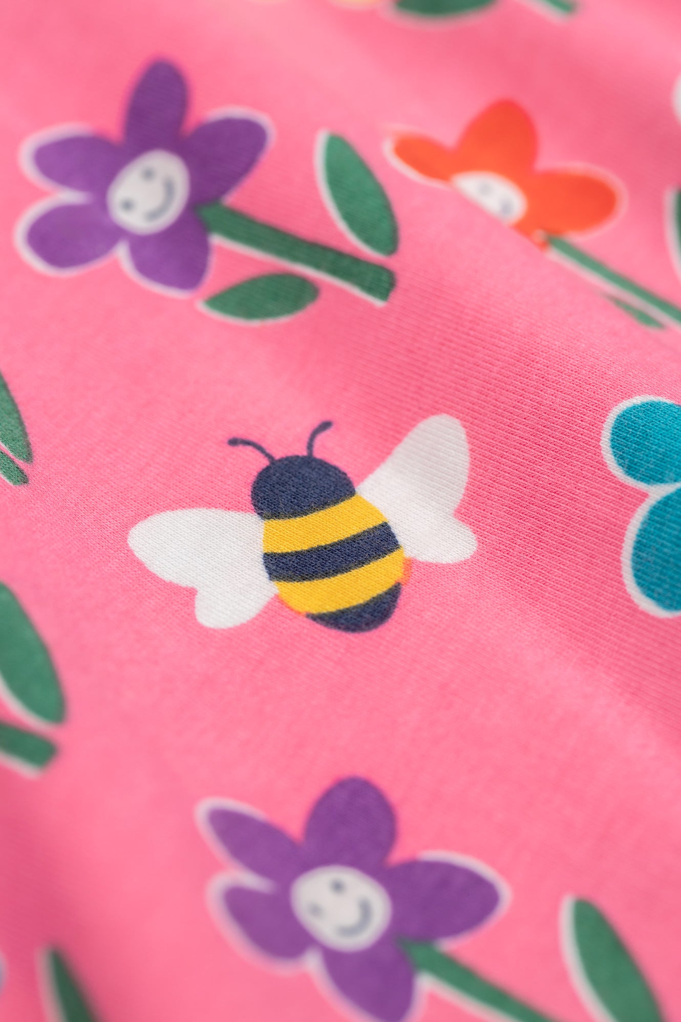 Detailed bee design on Frugi organic cotton trousers