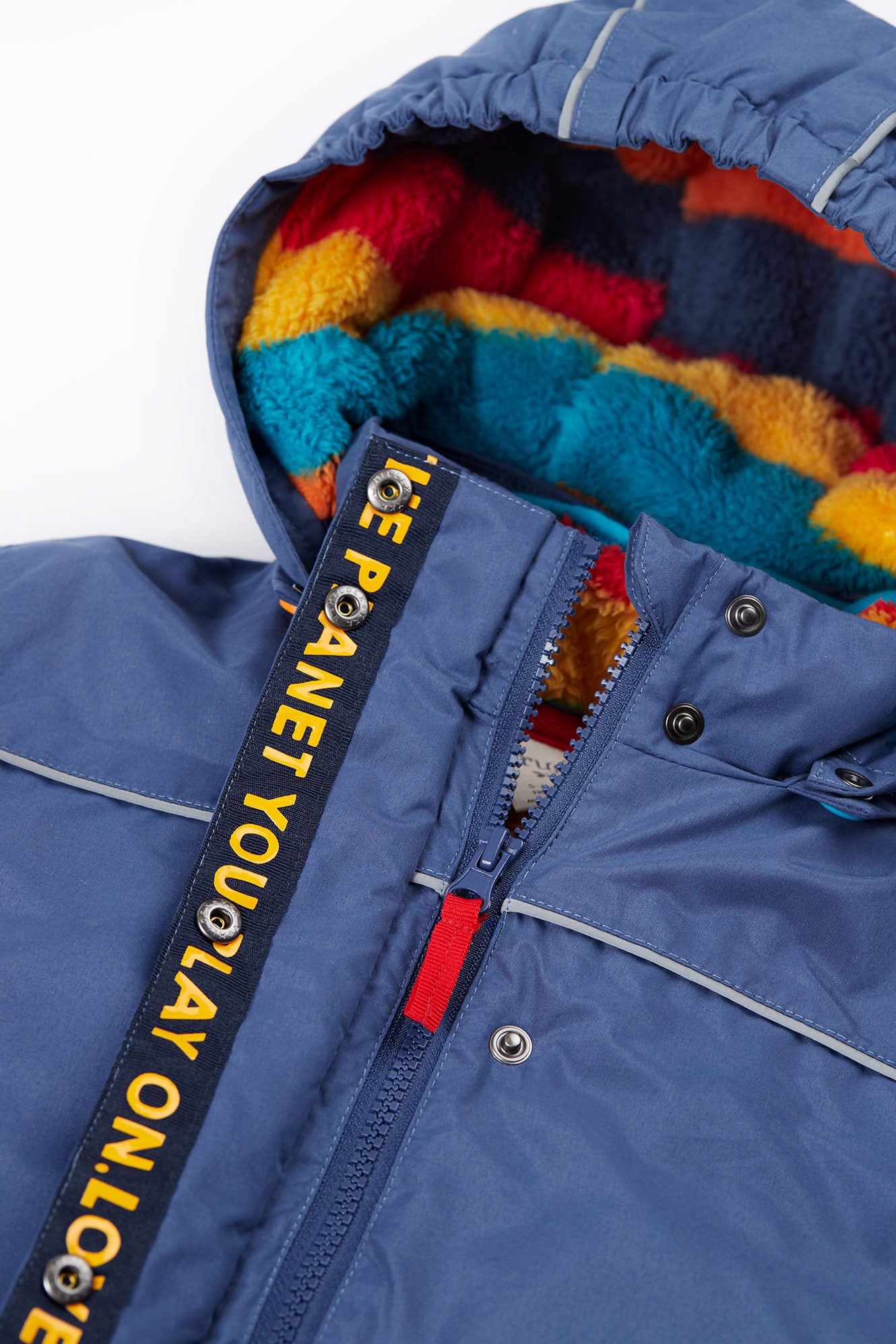 Blue jacket with colorful hood and 'LOVE PLANET YOU PLAY ON' strap.