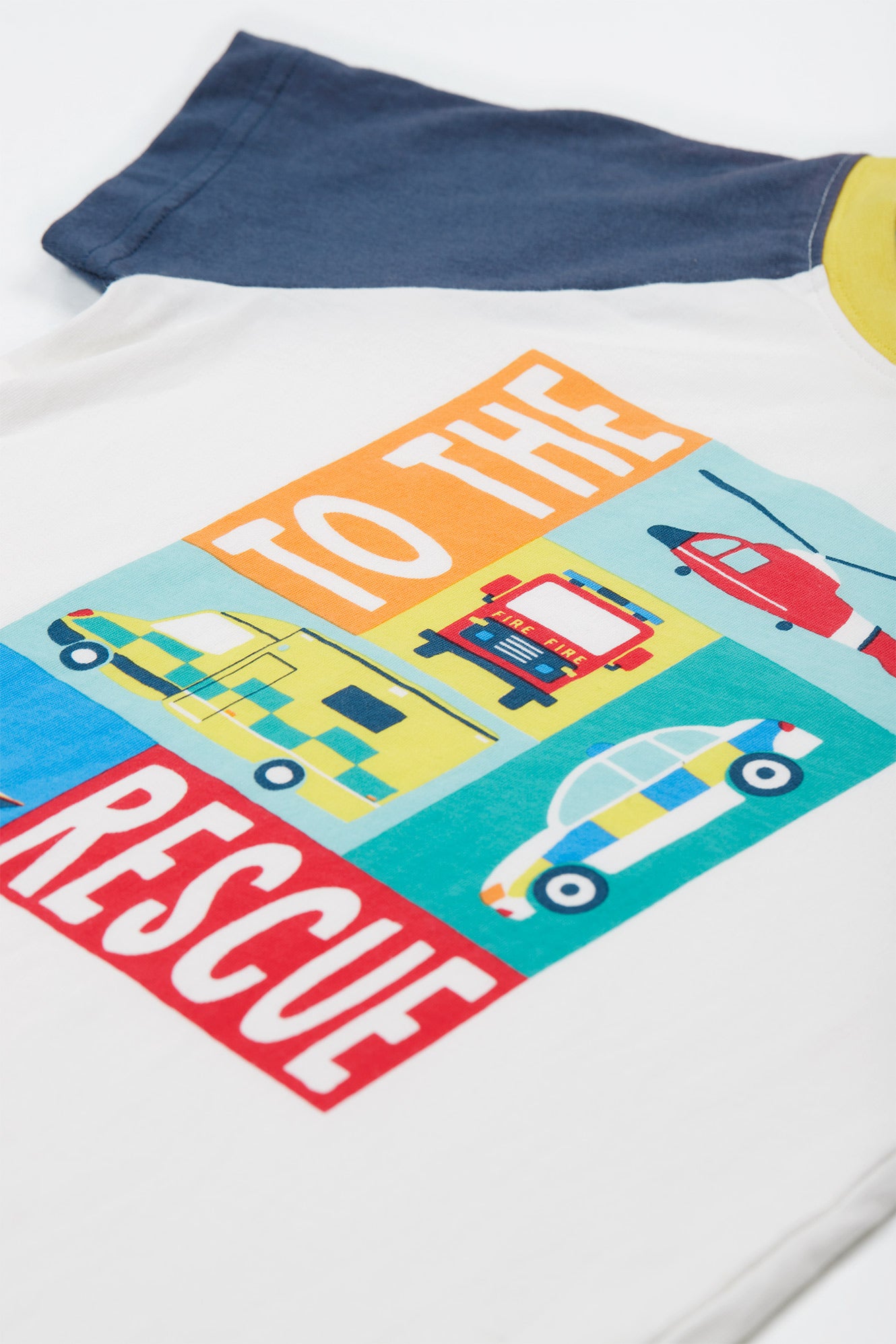 Detailed view of the 'TO THE RESCUE' graphic on the Frugi Reid Raglan T-Shirt, showcasing illustrations of various rescue vehicles.