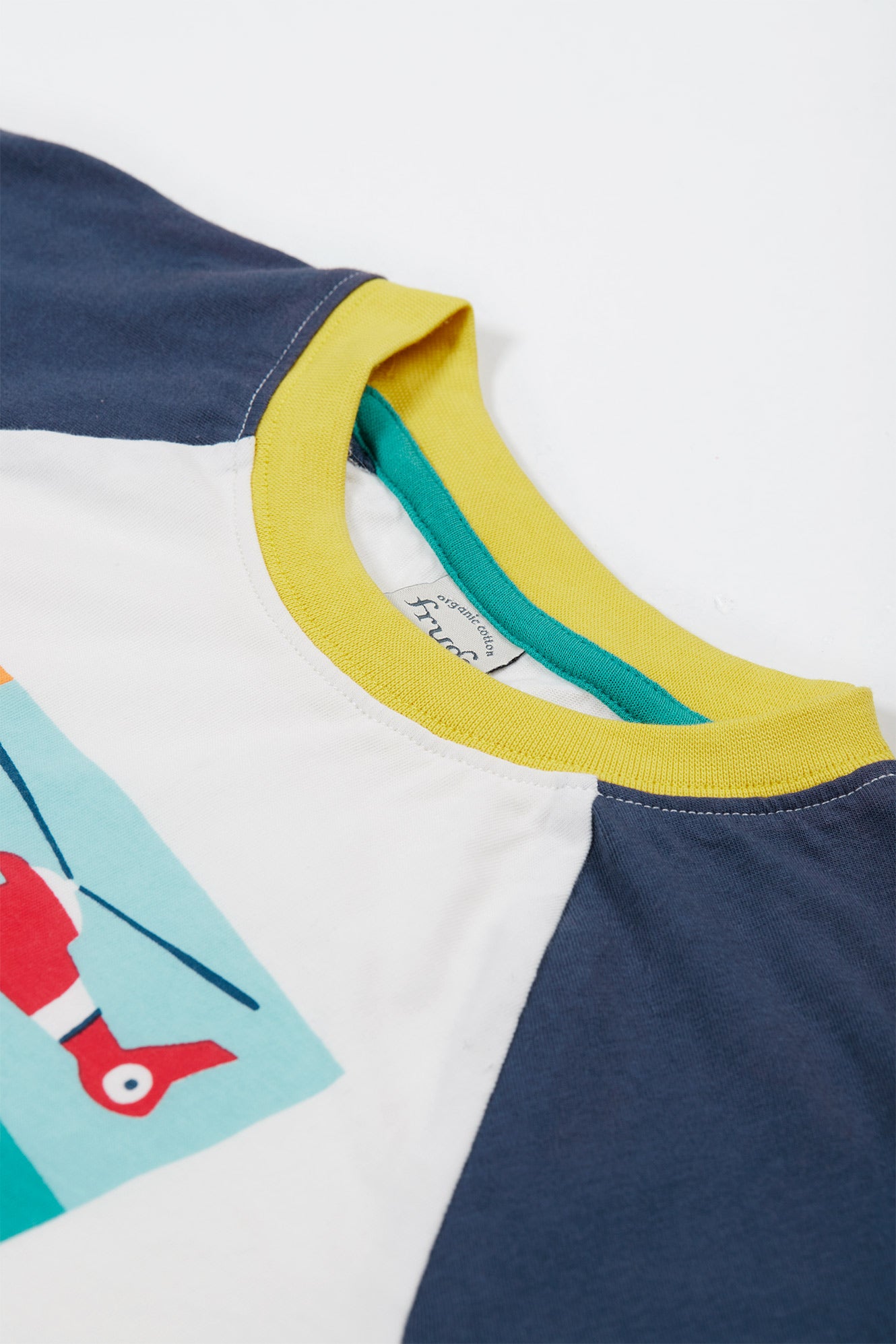 Close up of yellow neckline on Frugi organic cotton t-shirt.