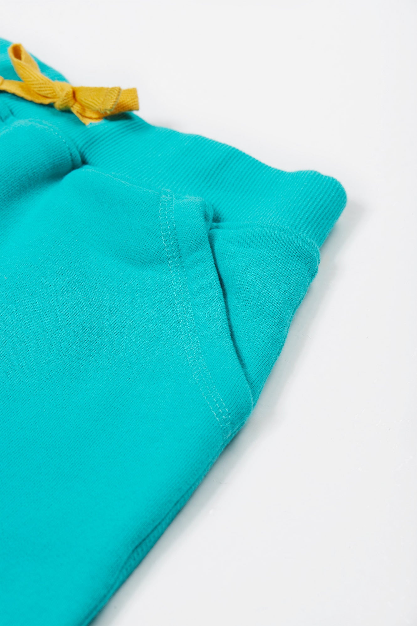 Close up of organic cotton fabric and pocket detail on Samson shorts.