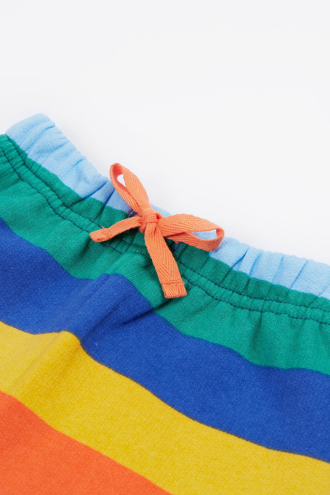 Close up of orange drawstring on frugi snuggle crawlers