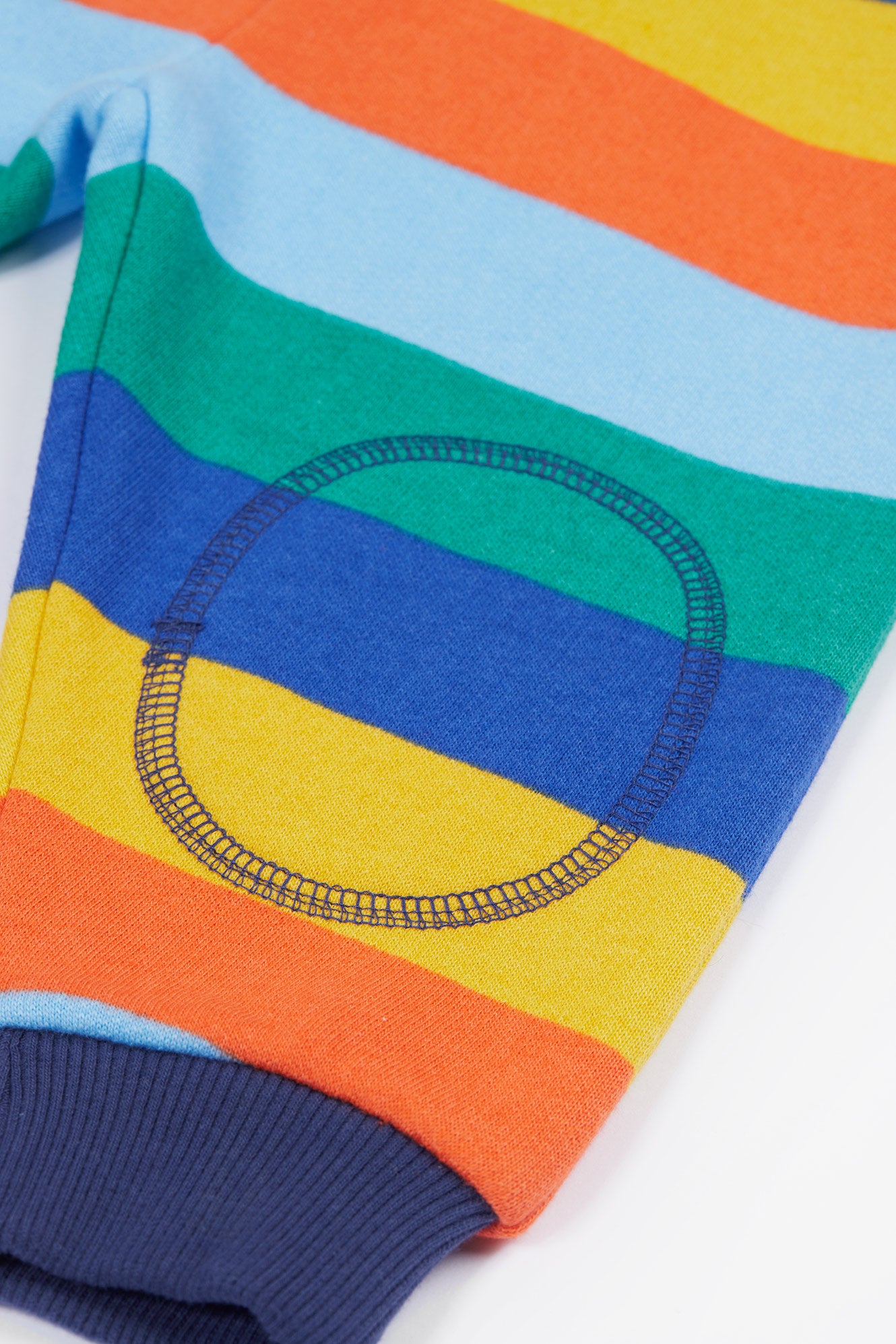 Close up of stitched double-layered knees on frugi organic cotton trousers