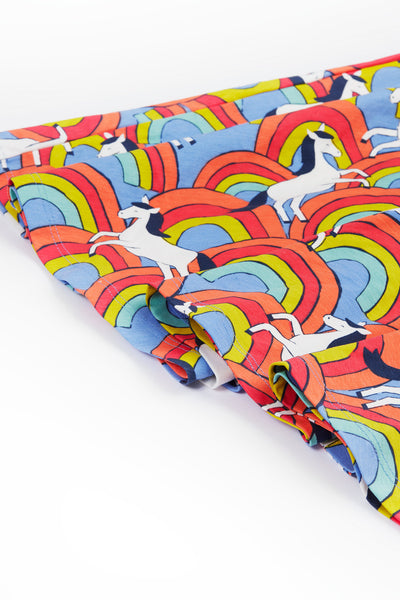 Close-up of vibrant rainbows and horses print.