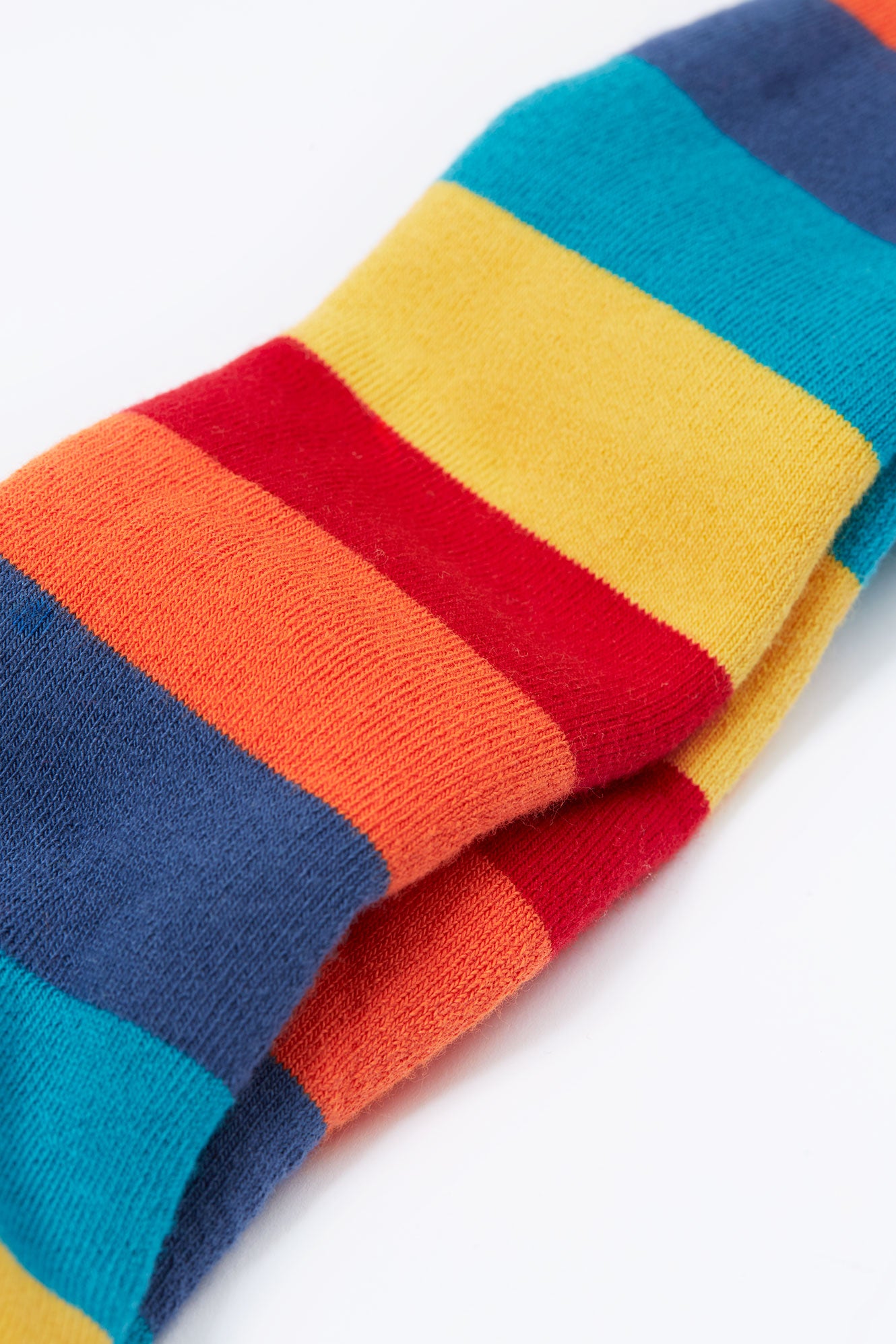 Colorful striped sock with red, yellow, blue, and orange on a white background