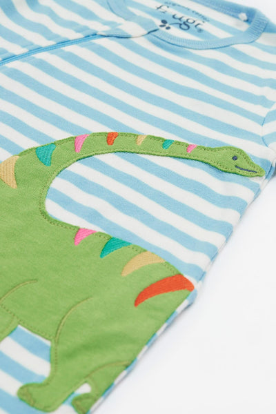 Close up of dino embroidery detail and soft organic cotton fabric.