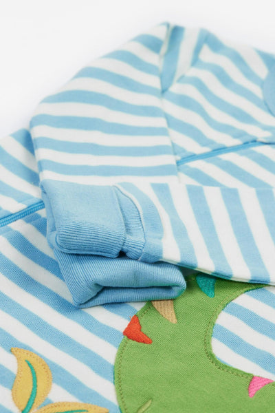 Close up of blue folded cuffs and concealed zip for easy dressing.