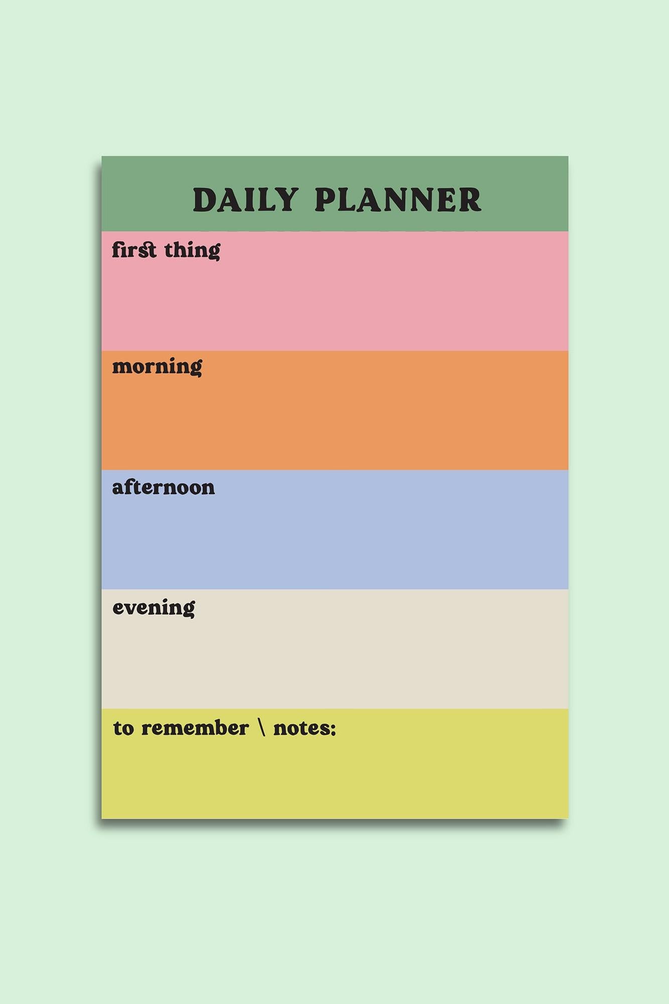 Colorful daily planner with time slots on a light green background