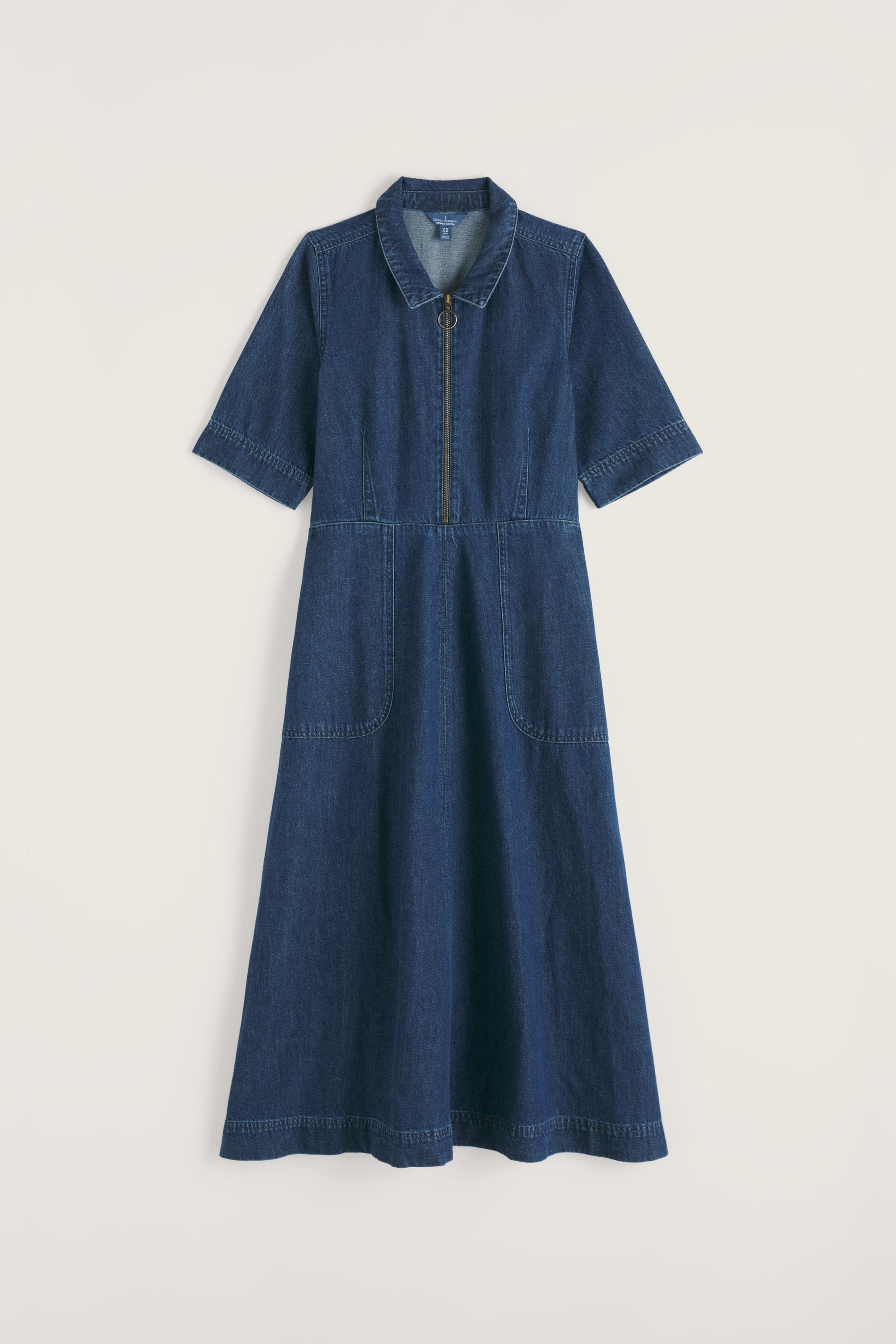 Blue organic cotton dress with a zipper on a light gray background