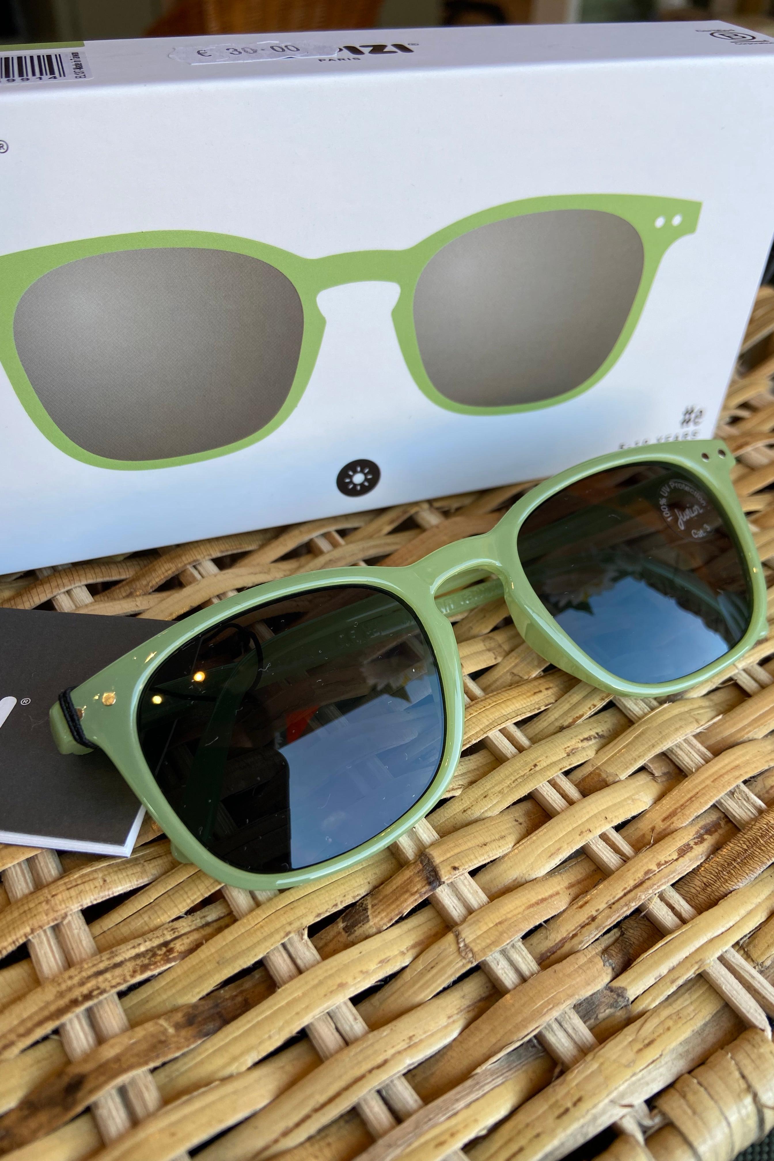 ZIPIZI Junior Sun #E sunglasses in Pear, featuring a trapezoidal shape with a pearlescent finish, suitable for children aged 5-10.