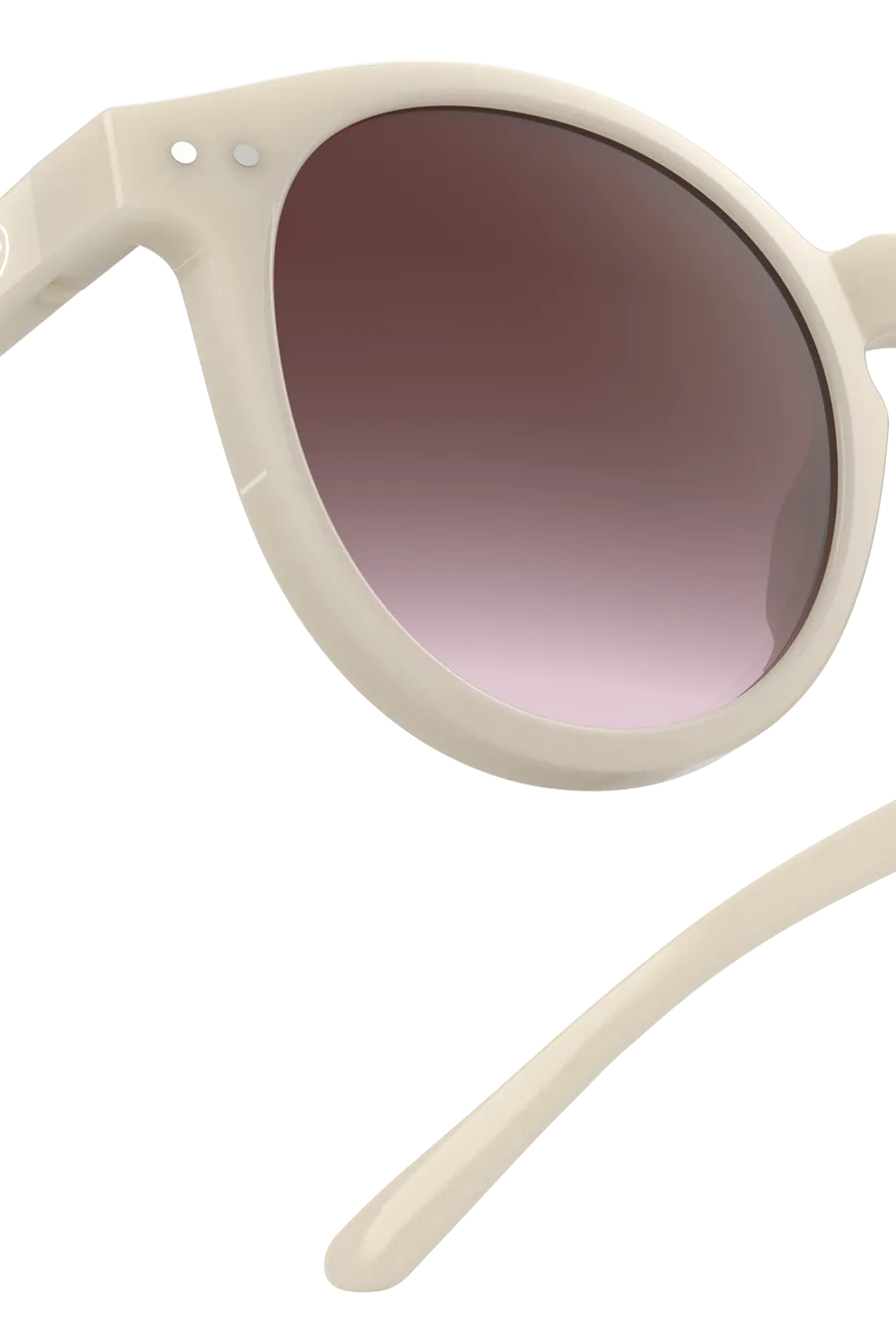 Close up of the Izipizi M Vintage Cream sunglasses, showcasing their round design.