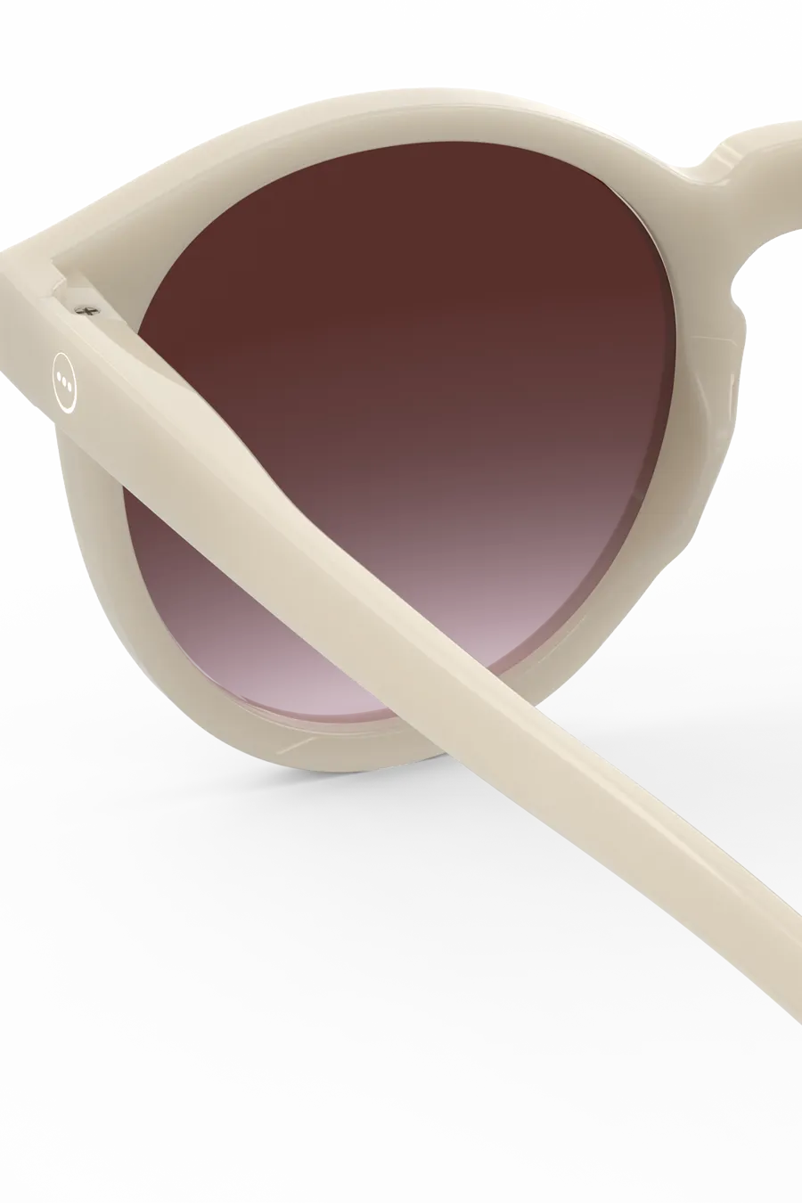 Back view of the Izipizi M Vintage Cream sunglasses, showcasing their violet lenses and logo on glasses arm.