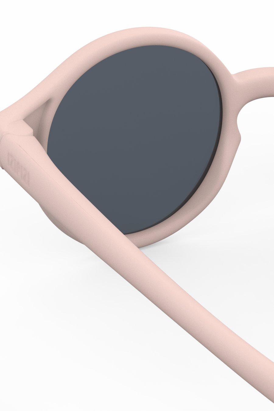 Baby sunglasses with dark lenses and beige frames on a white background