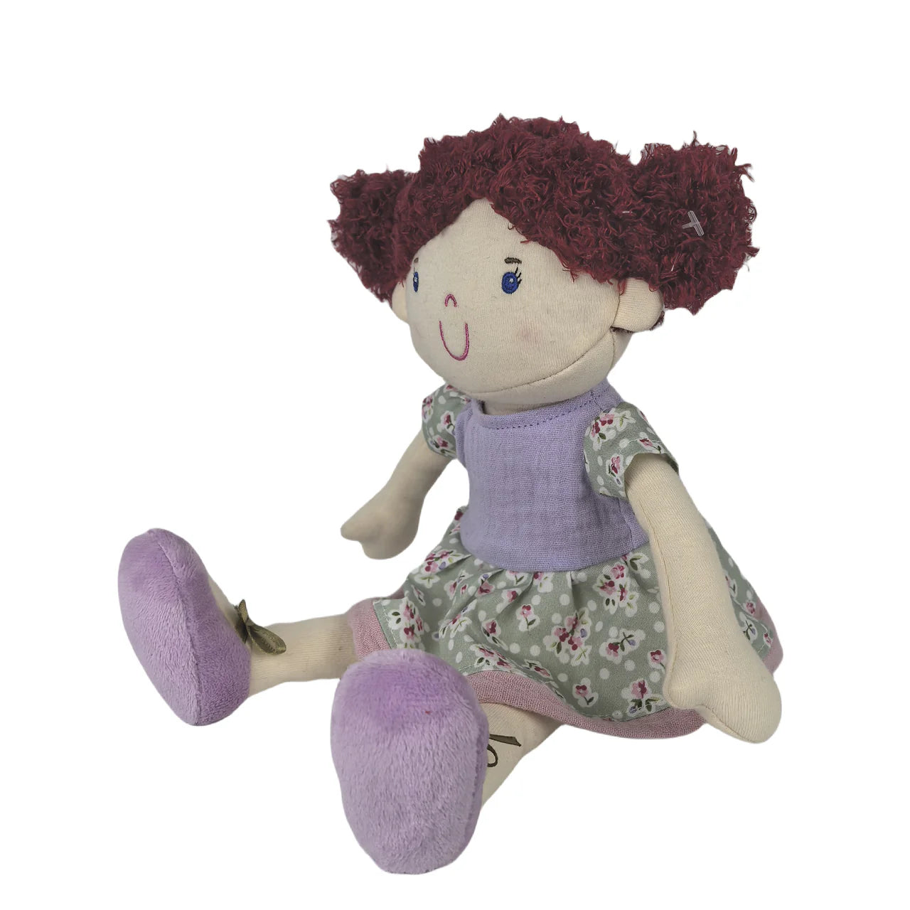 Plush doll with red hair, purple shoes, and a floral dress on a white background