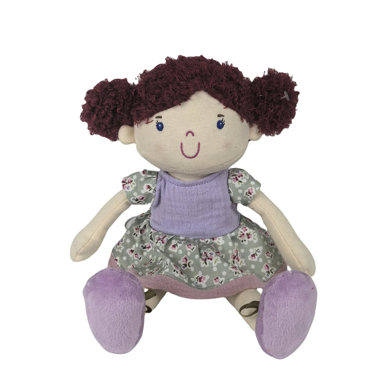 Toy doll with brown hair, purple outfit, and floral dress on a white background