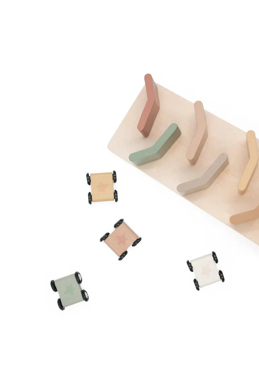 Wooden cars with different shapes and colors on a white background