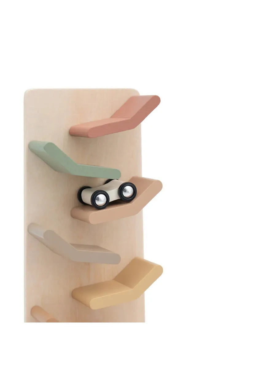Wooden toy with multiple shelves and a small car on a white background